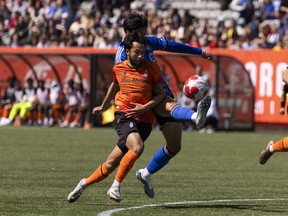 Forge FC midfielder David Choiniere (7) battles for a ball with CF Montreal midfielder Fernando Alvarez (4) during first half Canadian Championship soccer action in Hamilton, Ont., Tuesday, May 7, 2024.