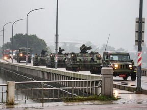 Taiwanese armoured vehicles roll down a street in Kinmen on May 24, 2024.