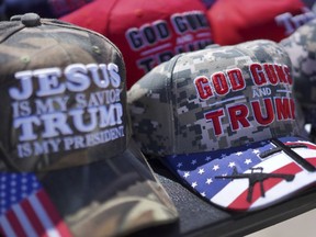 Hats supporting former president Donald Trump are sold at a campaign rally in Vandalia, Ohio, on Saturday, March 16, 2024.