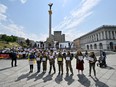Relatives of Ukrainian military servicemen fighting with Russian troops stand to demand a rotation for their return from the front lines, at Independence Square in Kyiv, on May 18, 2024, amid the Russian invasion of Ukraine.
