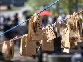 Pens and blank tags are supplied for anyone so inclined to leave a message on a line at the pro-Palestinian encampment on the McGill University campus in Montreal on Friday May 10, 2024.