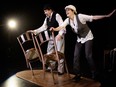 A woman and man in bowler hats dance with chairs on a stage.