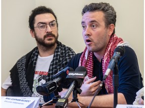 UQAM encampment spokesperson Karim El Zein watches Niall Clapham-Ricardo of Independent Jewish Voices speak into microphones at a news conference organized by the Coalition du Québec Urgence Palestine.