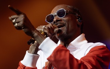 Snoop Dogg gesticulates as he performs