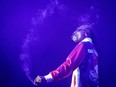 Snoop Dogg smokes a joint on stage