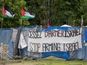 Palestinian flags fly from within the pro-Palestinian encampment on the campus of McGill University in Montreal on Tuesday, June 11, 2024.