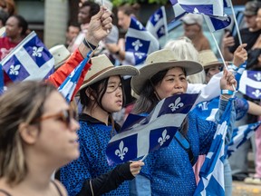 The Fete nationale parade travelled along Rachel Street in Montreal's St-Michel district on Monday.