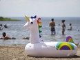A unicorn-themed floating device sits on the beach at the Cap St-Jacques nature park in Pierrefonds.
