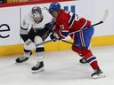 Los Angeles Kings' Quinton Byfield (55)  and Canadiens' Kaiden Guhle (21) in Montreal on Dec. 7, 2023. The Habs have acquired the 21st overall draft pick from Los Angeles in exchange for the 26th pick, the 57th pick (second round) and the 198th pick (seventh round).