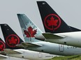 Air Canada planes sit on the tarmac at Pearson International Airport during in Toronto on Wednesday, April 28, 2021.