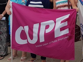 A flag shows the logo of the Canadian Union of Public Employees.