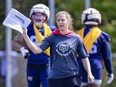 Émilie Pfeiffer-Badoux, an assistant special teams coach with the Concordia Stingers, helps out as a guest coach during Alouettes training camp practice in St-Jérôme on May 23, 2024.