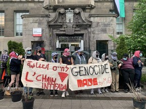 Pro-Palestinian protesters block entrance to James Administration building at McGill