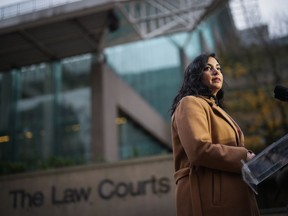 B.C. Attorney General Niki Sharma pauses while responding to questions outside B.C. Supreme Court in Vancouver, Monday, Nov. 27, 2023.