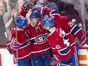 Canadiens' Torrey Mitchell, facing camera, celebrates with teammates Brendan Gallagher (11), Paul Byron (41) and Jeff Petry (26) after scoring during a game in 2016.