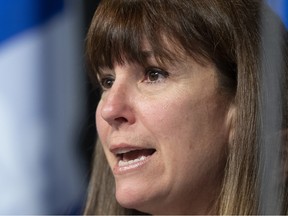 Catherine Lemay in a closeup photo with a Quebec flag behind her head