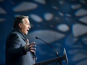 Premier François Legault speaks from a lectern at he CAQ's council meeting in St-Hyacinthe on May 25, 2024.