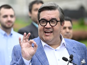 Denis Coderre gives the OK sign with his fingers