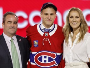 Canadiens draft pick Ivan Demidov is flanked by Canadiens president Geoff Molson and Céline Dion.