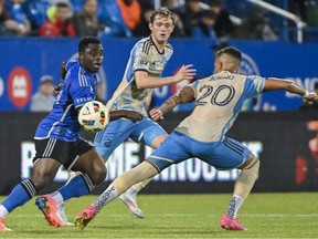 CF Montréal forward Sunusi Ibrahim, left, tries to get around Philadelphia Union's Jesús Bueno (20) during second half MLS soccer action in Montreal on Saturday, June 29, 2024.