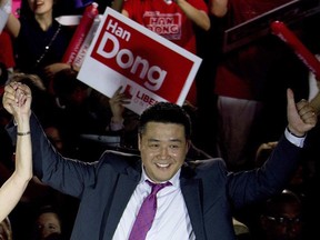 Provincial Liberal candidate Han Dong celebrates with supporters while taking part in a rally in Toronto on Thursday, May 22, 2014.