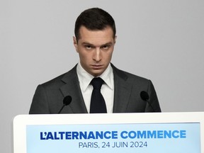 Far-right National Rally party president Jordan Bardella gives a press conference, Monday, June 24, 2024 in Paris. The upcoming two-round parliamentary election will take place on June 30 and July 7.