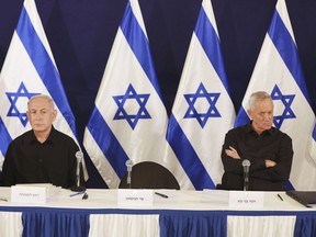 Israeli Prime Minister Benjamin Netanyahu and Cabinet minister Benny Gantz attend a news conference in the Kirya military base in Tel Aviv, Israel, on Oct. 28, 2023.
