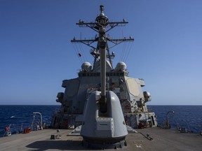 The Arleigh Burke-class guided missile destroyer USS Laboon sails in the Red Sea on Wednesday, June 12, 2024.