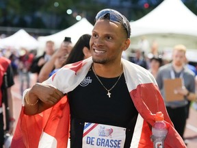 Andre De Grasse, celebrates his win in the 100m finals at the Canadian Track and Field Olympic trials in Montreal, Friday, June 28, 2024.