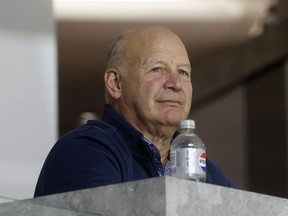 Head coach Claude Julien is seen with a bottle of Diet Pepsi in front of him as he watches a hockey game.