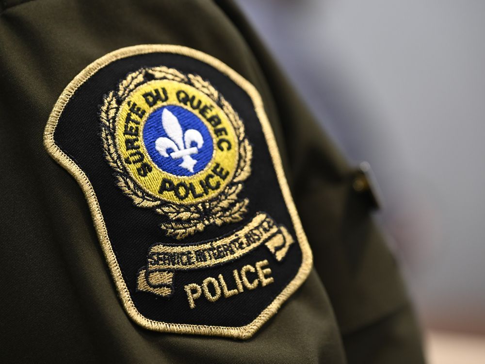 A 31-year-old man has been arrested in connection with the death of a young child in a boating incident in Quebec's Laurentians. A S&ucirc;ret&eacute; du Qu&eacute;bec patch is seen on an officer's uniform at a news conference in this file photo.