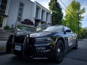 A Vancouver Police Department patrol car sits in front of the Schara Tzedeck synagogue, in Vancouver, B.C., Friday, May. 31, 2024.