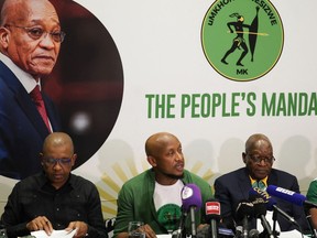 uMkhonto weSizwe (MK) party leader and South Africa's former president Jacob Zuma (C) and MK party's spokesperson Nhlamulo Ndhlela (L) and MK legal representative Dali Mpofu (L) give a press conference in Johannesburg on June 16, 2024.