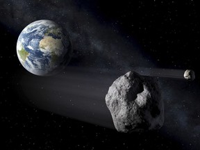In this artistic rendering, two asteroids fly past Earth.