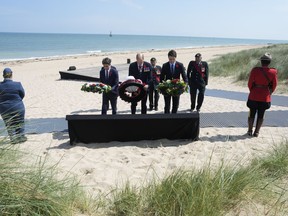 Prime Minister of France Gabriel Attal, Prince William, the Prince of Wales, and Prime Minister Justin Trudeau lay wreaths during a ceremony to mark the 80th anniversary of D-Day, at Juno Beach in Courseulles-sur-Mer, Normandy, France, Thursday, June 6, 2024.