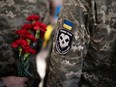 A "Ghost of Kyiv" patch is seen on the uniform of a Ukranian serviceman attending the funeral of Ukrainian Air Force colonel Valentyn Korenchuk, one of the "Ghost of Kyiv" pilots, at the St. Michael's Golden-Domed Monastery in Kyiv on June 18, 2024, amid the Russian invasion of Ukraine.