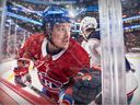 Montreal Canadiens' Raphaël Harvey-Pinard avoids a check by Columbus Blue Jackets Brendan Gaunce during first period of National Hockey League game in Montreal Tuesday March 12, 2024.