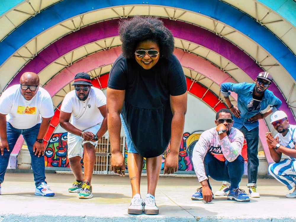 BCUC members crouch down in a publicity photo