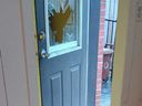 The back door of a home in Montreal's Chinatown neighbourhood had its window smashed in by a brick by a man who then wielded a knife and a fire extinguisher on July 11, 2024.
