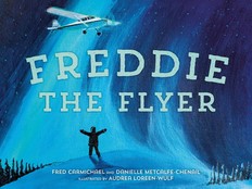 A children's book cover illustration depicts a silhouetted figure on the snowy ground with arms outstretched, and a propeller plane flying overhead. The title Freddie the Flyer is superimposed.