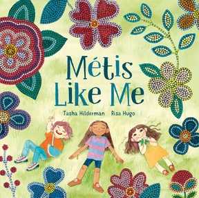 A children's book cover illustration shows three kids lying on the grass and pointing up at beadwork. The title Métis Like Me is superimposed.