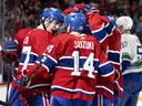 Canadiens' Kirby Dach, left, celebrates a goal with his teammates during a game in 2022. Dach needs to prove he can stay healthy, Stu Cowan writes.