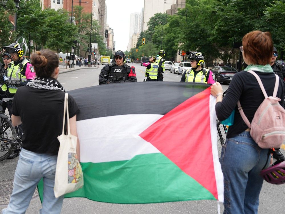 Police block protesters from the campus as security clears the pro-Palestinian encampment at McGill University in Montreal, Wednesday, July 10, 2024.
