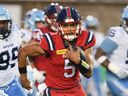 Alouettes 'didn't skip a beat' transitioning to Caleb Evans as quarterback 3 Montreal Alouettes quarterback Caleb Evans (5) runs for a first down against Toronto Argonauts during first half CFL football action in Montreal, Thursday, July 11, 2024.