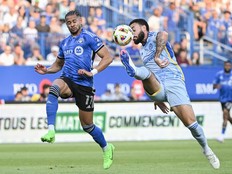 CF Montréal's Ariel Lassiter (11) and Atlanta United's Derrick Williams (3) challenge for the ball during first half MLS soccer action in Montreal on Saturday, July 13, 2024.