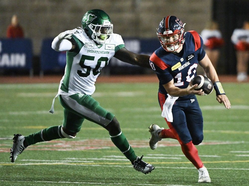 Montreal Alouettes quarterback Davis Alexander (10) breaks away from Saskatchewan Roughriders' Bryan Cox Jr. (50) during second-half CFL football action in Montreal July 25, 2024.