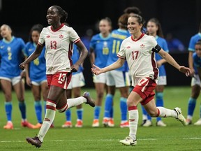 Canada's Simi Awujo, left, and Jessie Fleming celebrate winning in a shootout against Brazil in a SheBelieves Cup women's soccer game, Saturday, April 6, 2024, in Atlanta. Canada coach Bev Priestman unveils her 18-player roster for the Paris Olympics. The eighth-ranked Canadian women open defence of their Olympic title July 25 against New Zealand.