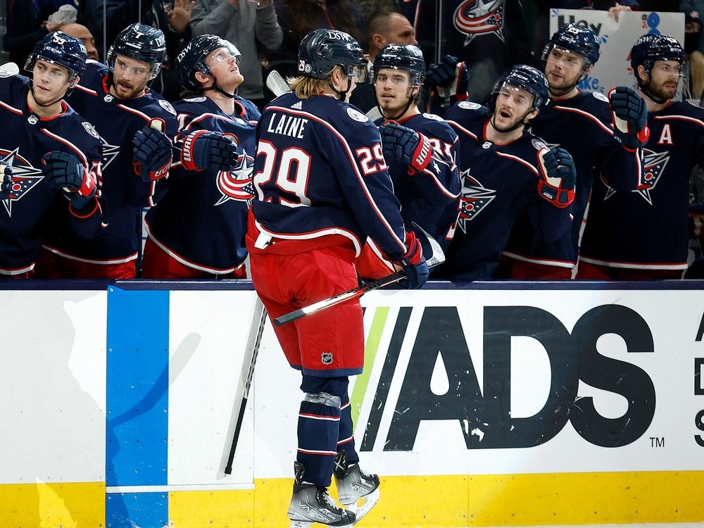 Patrik Laine is congratulated by his Blue Jackets teammates after scoring goal in game against the Toronto Maple Leafs on Feb. 22, 2022 at Nationwide Arena in Columbus.