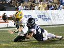 Elks quarterback McLeod Bethel-Thompson is tackled at the goal line by Alouettes' Isaac Adeyemi-Berglund during first half Sunday night at Molson Stadium.