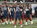 Montreal Alouettes' Shedler Fervius (87) and teammates celebrate near the end of a CFL football game against the Saskatchewan Roughriders in Montreal, Thursday, July 25, 2024.